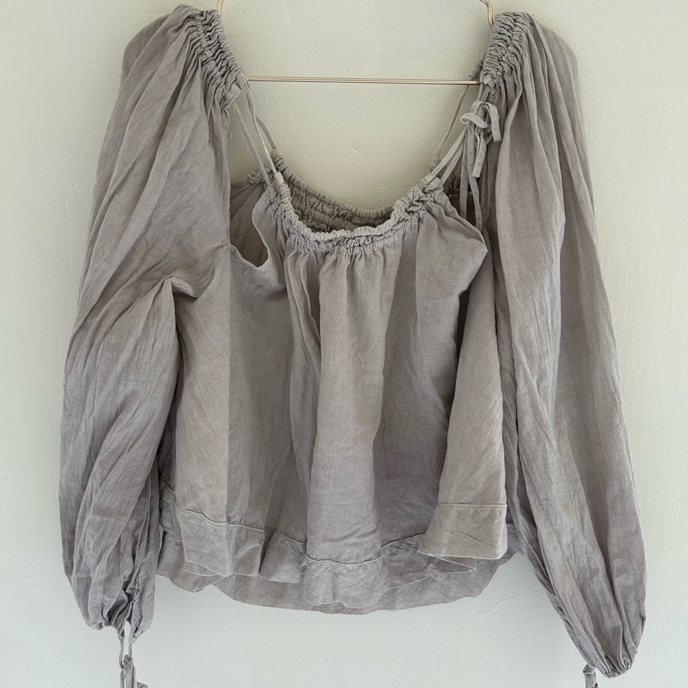 Free people loose long sleeve top with fun cut outs